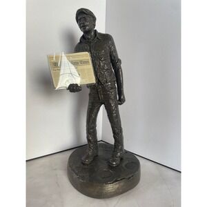 Michael Garman Newsman sculpture State Farm Campaign Big Dog is Off the Porch